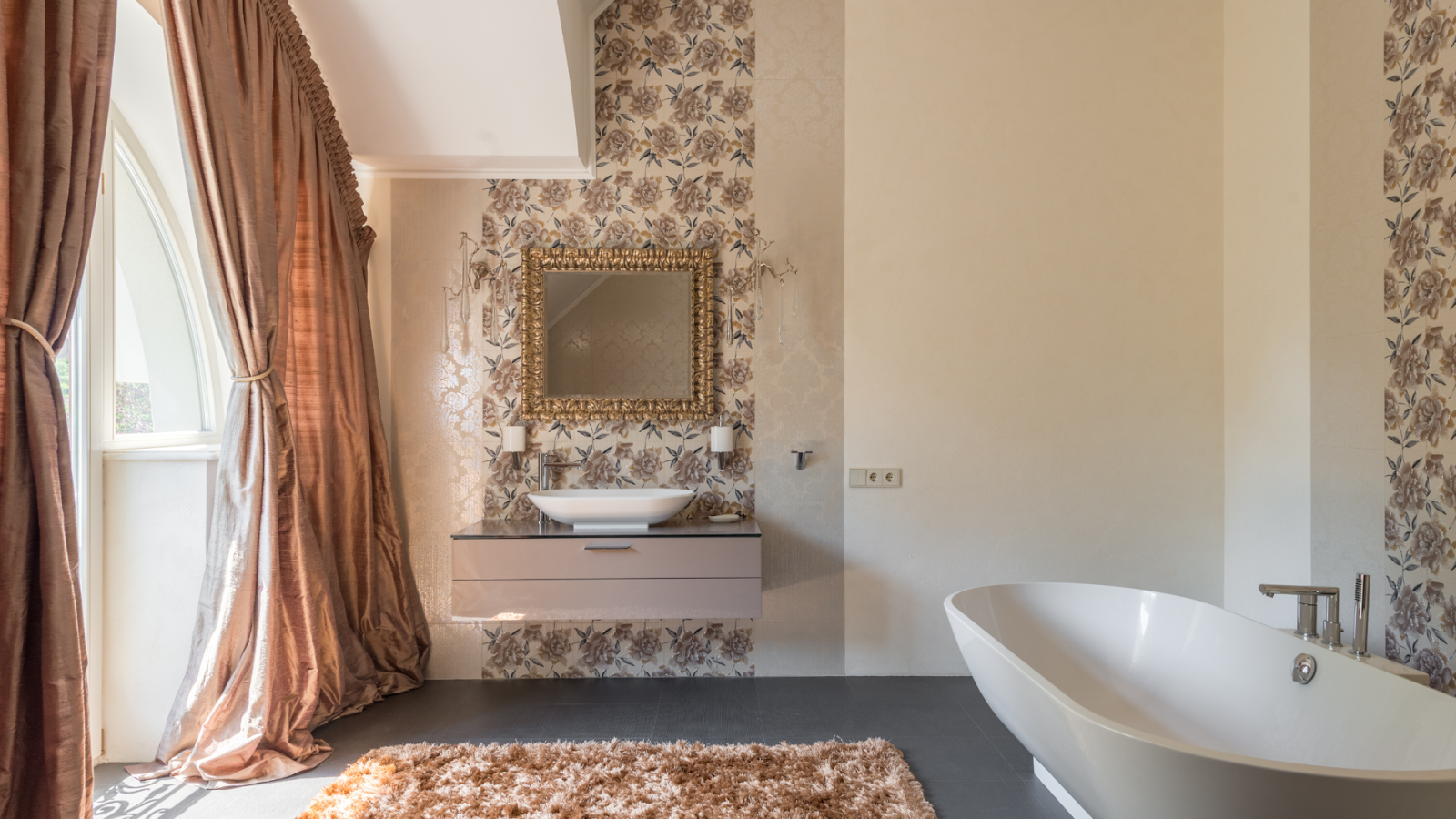 A bathroom with floral wallpaper.