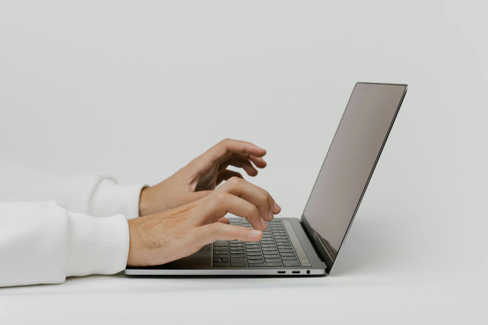 A person typing on a computer