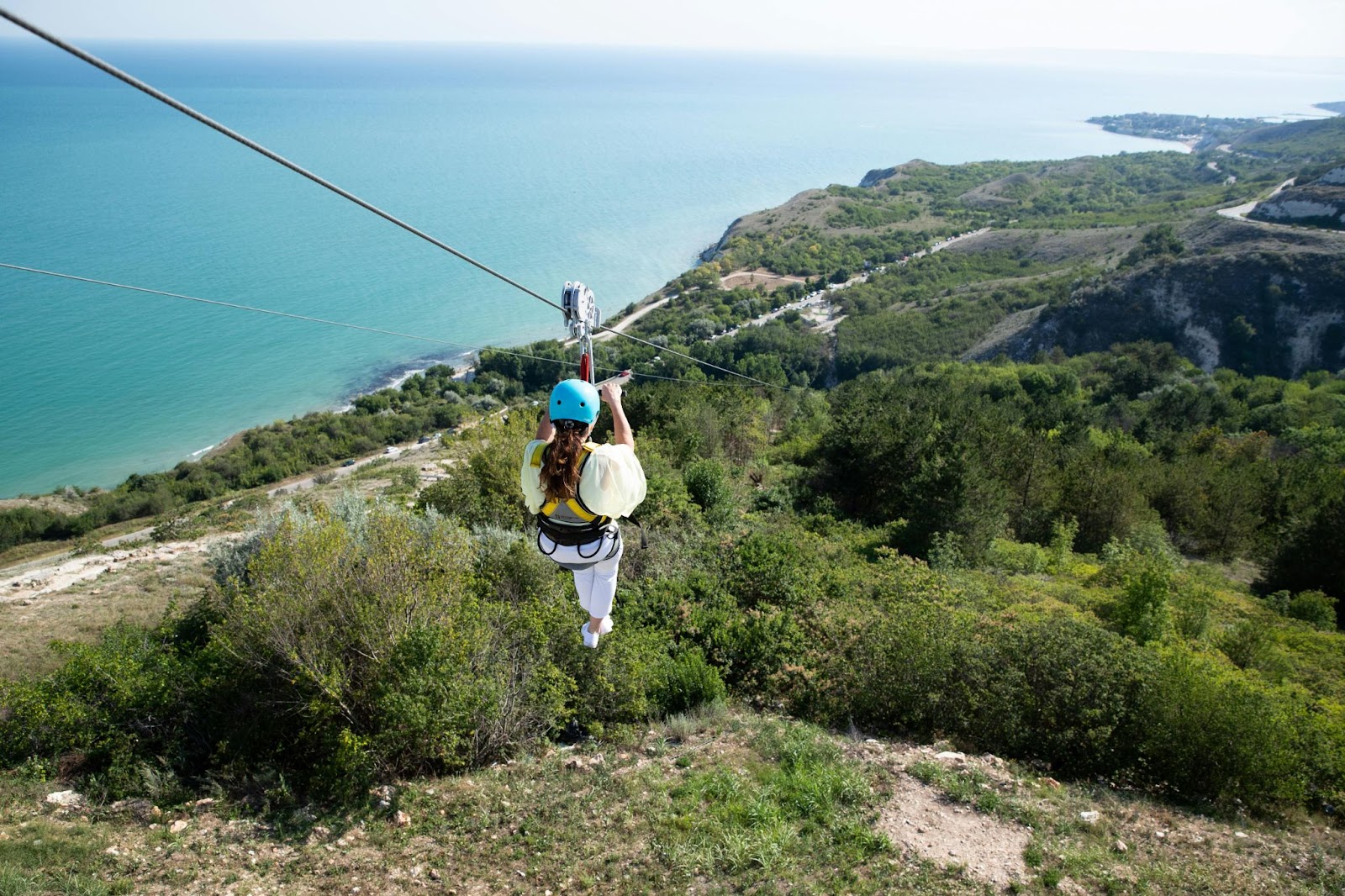 a woman ziplining bachelor party goals in Vegas