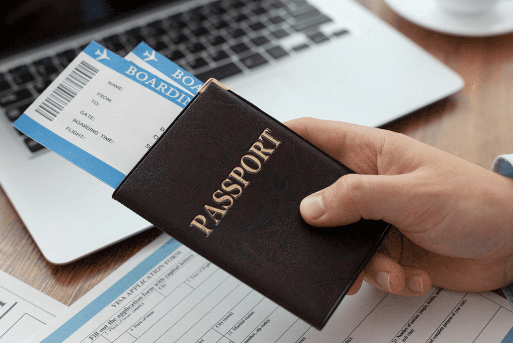 Person holding passport with two boarding pass within it