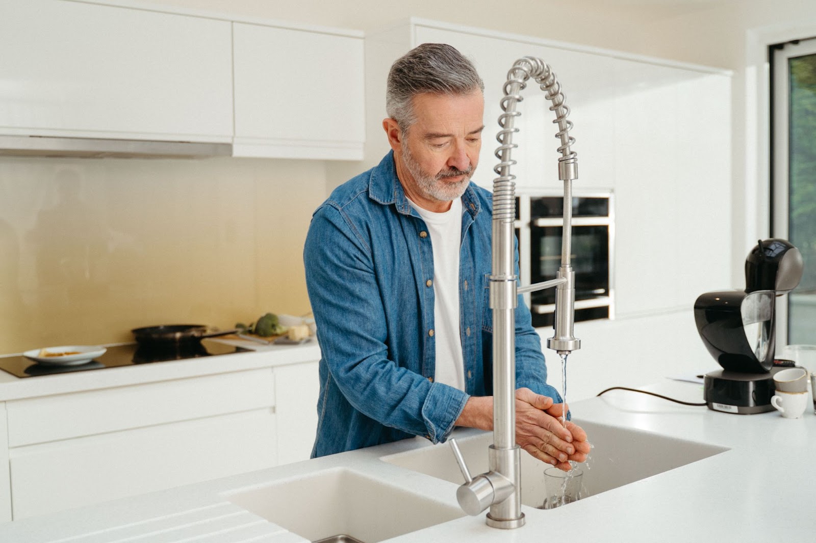 man using tap