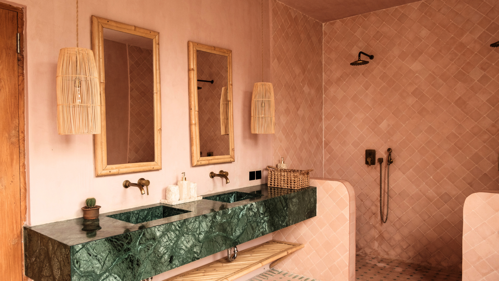 A bathroom that uses cost-effective materials such as wooden light fixtures.