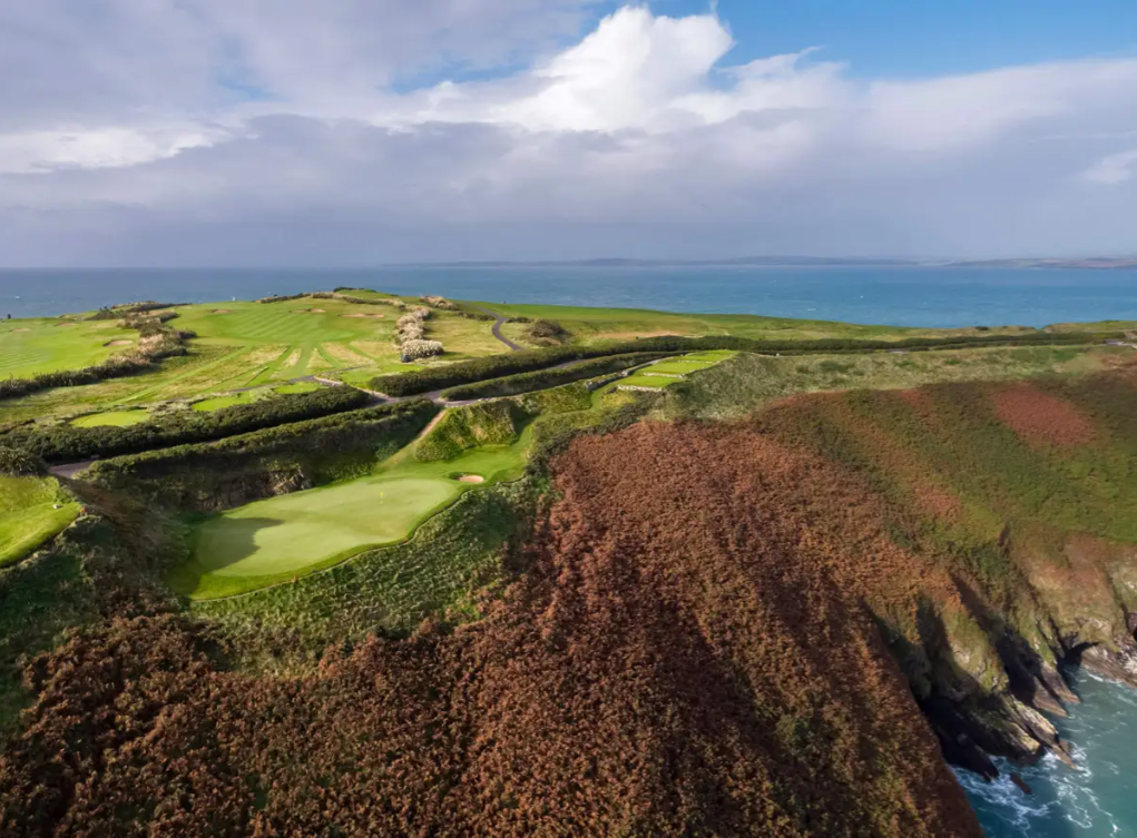 aerial view of old head of kinsale golf club on cliff edge