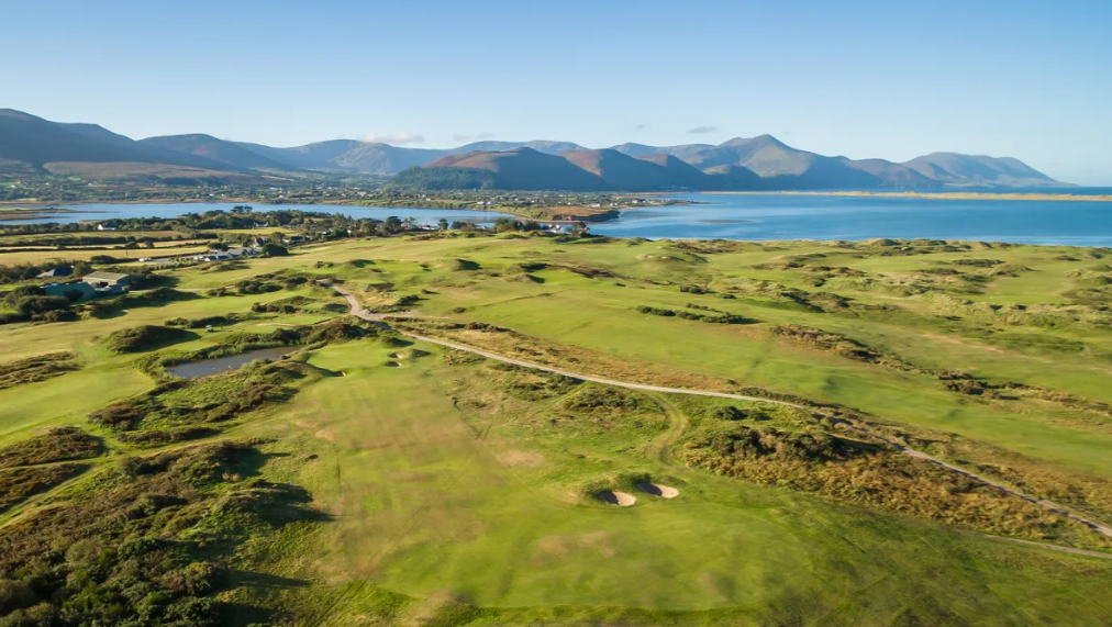 aerial view of dooks golf links with sea and mountains